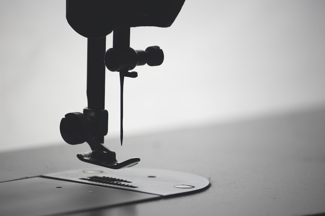 Photo by Ilya lix macro photography of sewing needle
